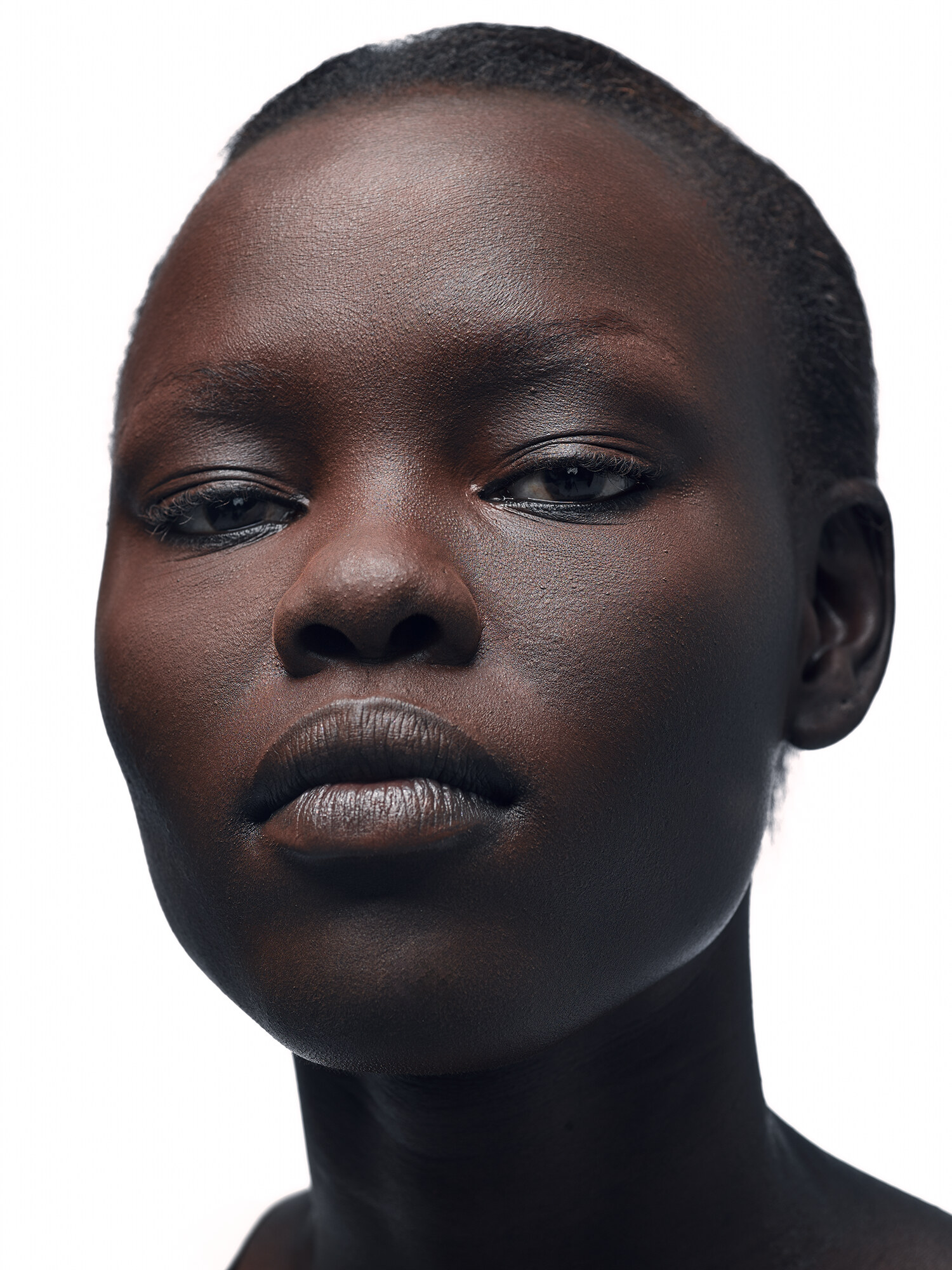 Grace Bol editorial beauty close-up, sculpted natural makeup on a clean white background. Beauty photography by Jason Guffy.