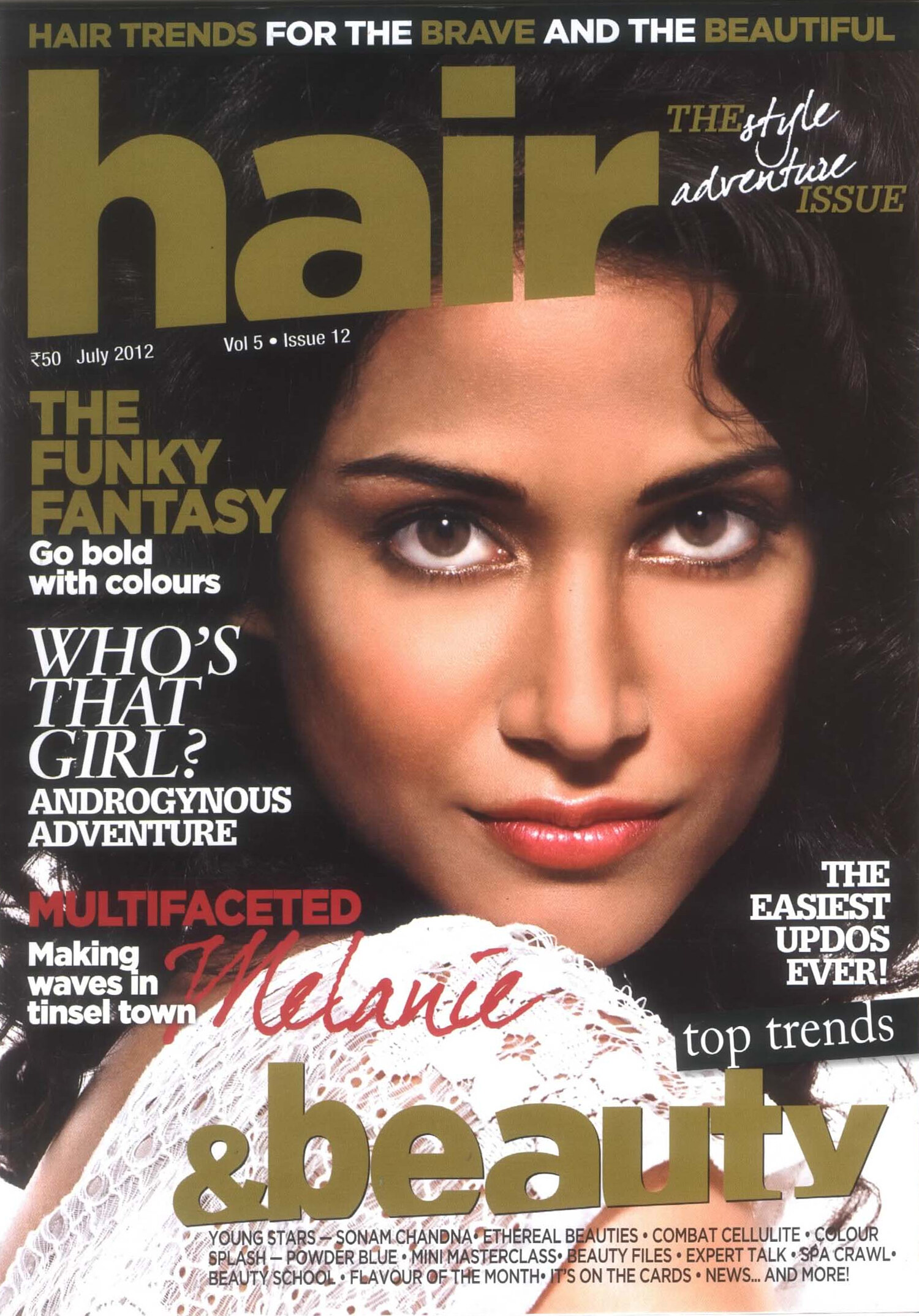 Melanie Chandra on the July 2012 cover of Hair magazine, beauty close-up with soft dark waves. Published cover photography by Jason Guffy.