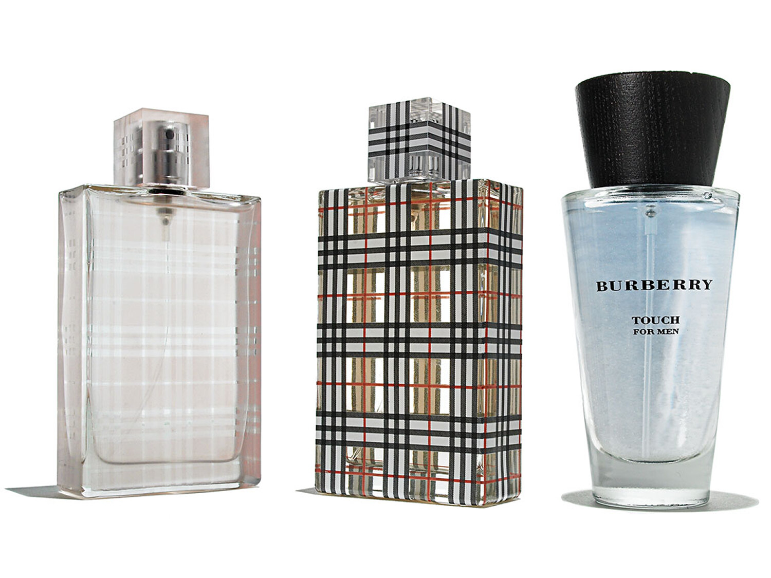 Designer fragrance bottles including Burberry on a white background, e-commerce still life. Product photography by Jason Guffy.