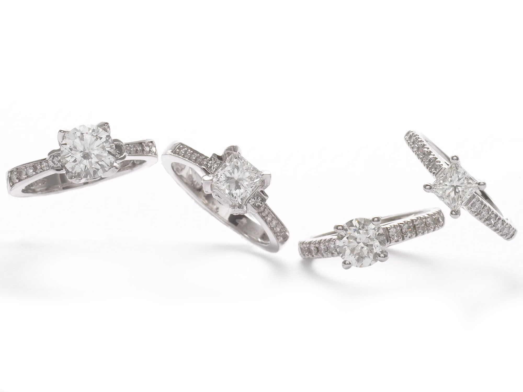 Platinum diamond engagement rings fine jewelry product photography on a white background. Jason Guffy Photography.