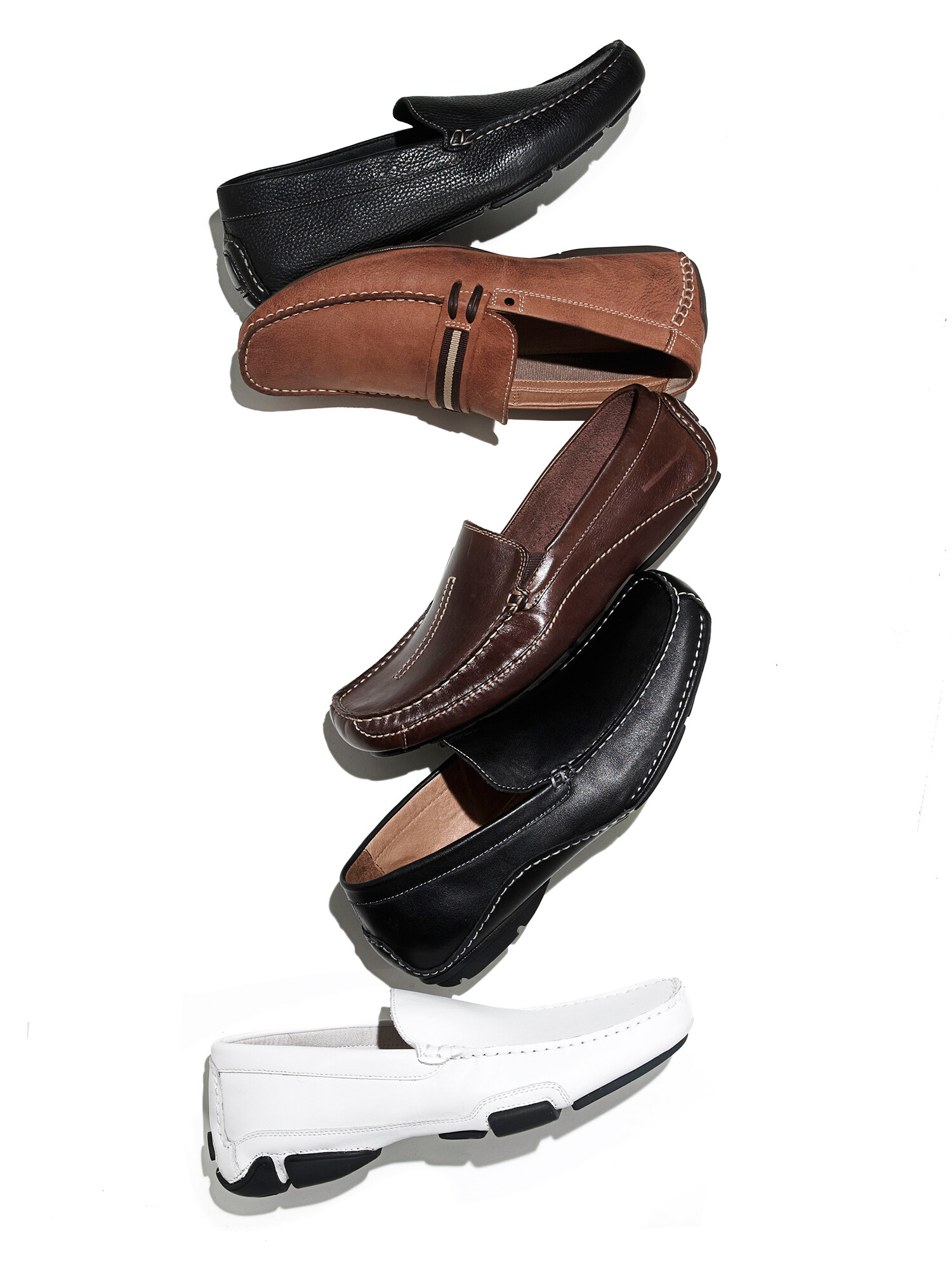 Brown leather footwear on a white background, e-commerce product still life. Product photography by Jason Guffy.