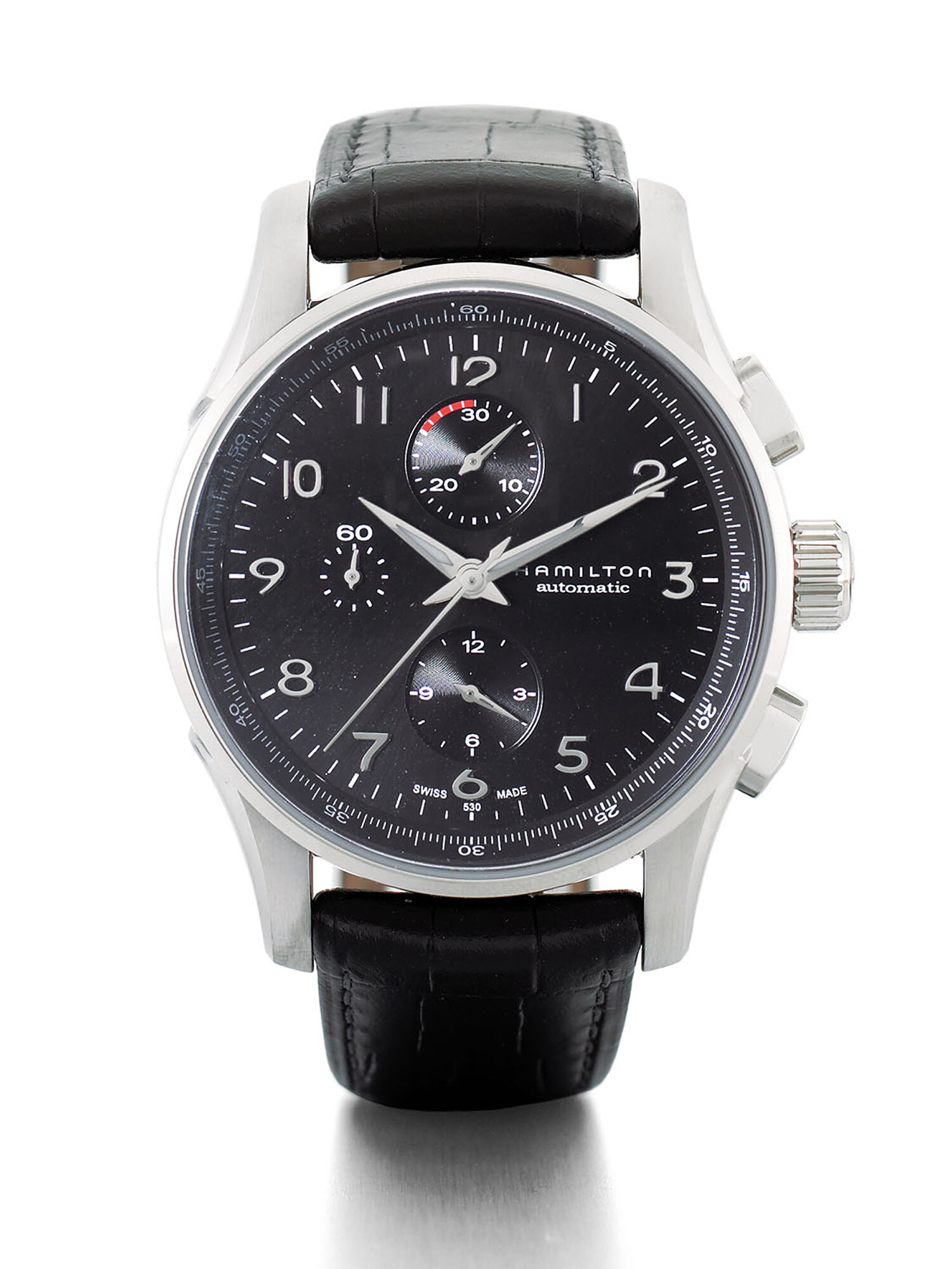 Hamilton silver chronograph watch with a black dial and leather strap on a white background. Product photography by Jason Guffy.
