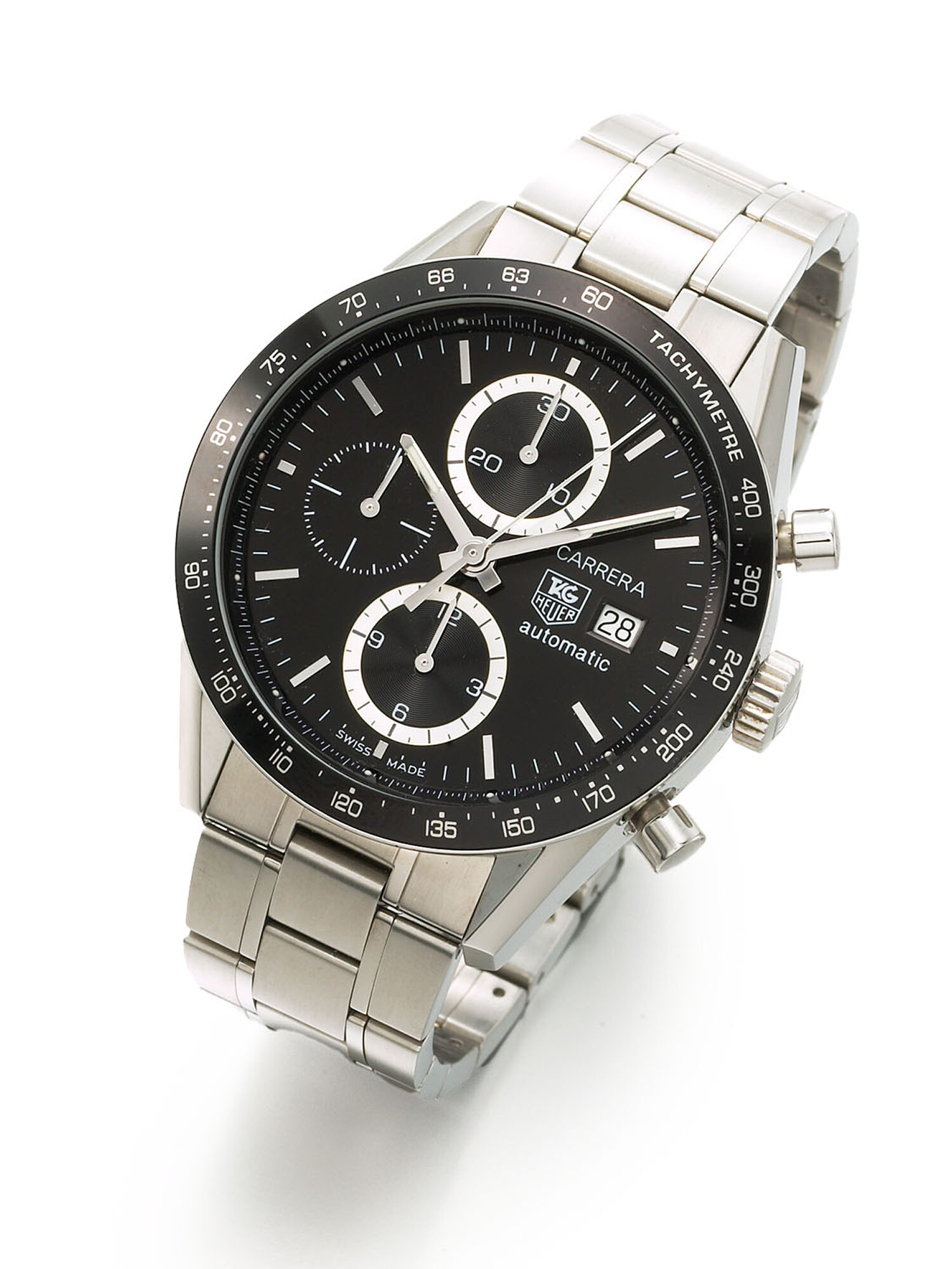 TAG Heuer Carrera watch with a black dial and black bezel on a white background. Product photography by Jason Guffy.