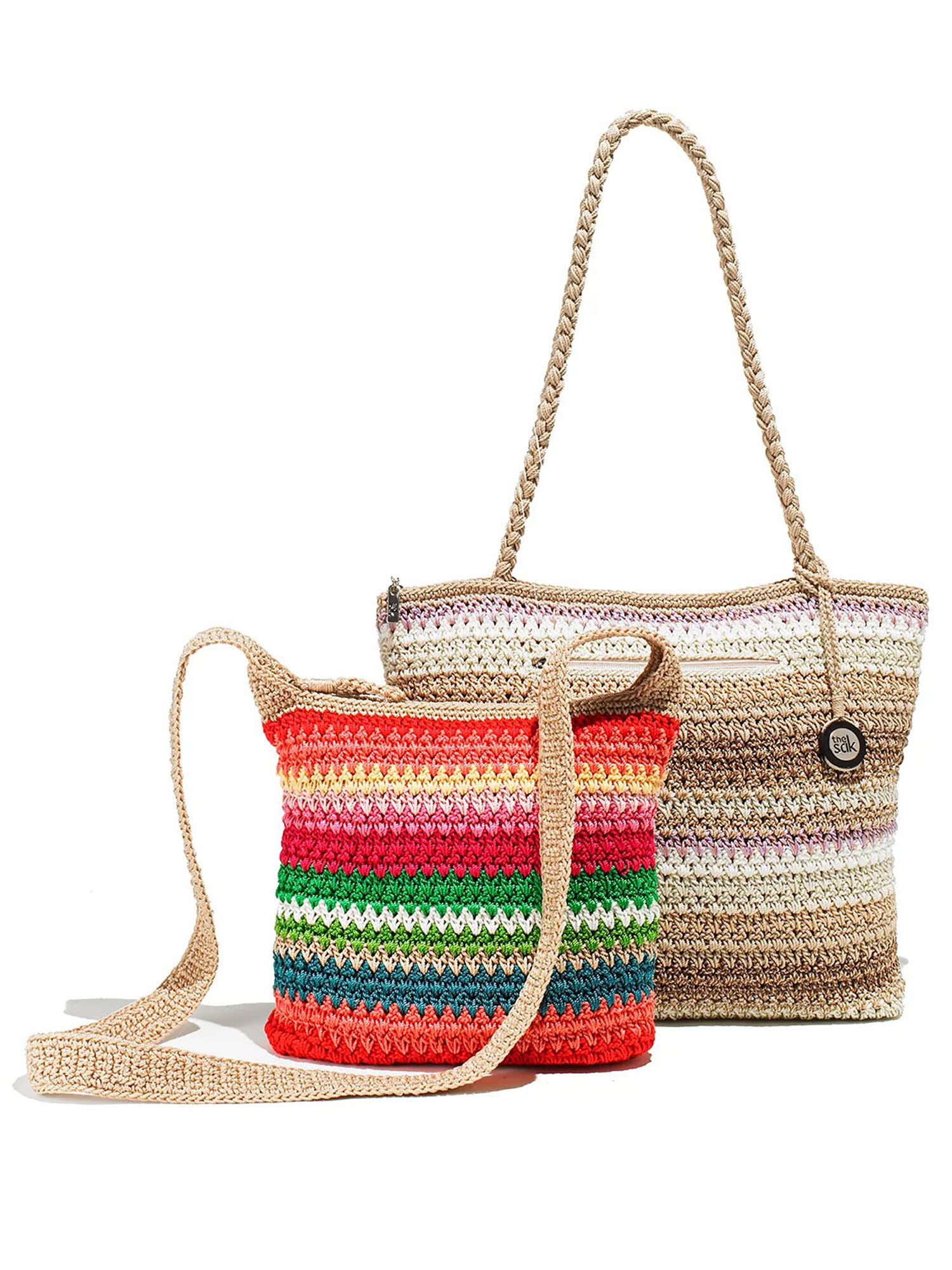 Woven straw beach tote handbags with colorful stripes on a white background. Product photography by Jason Guffy.