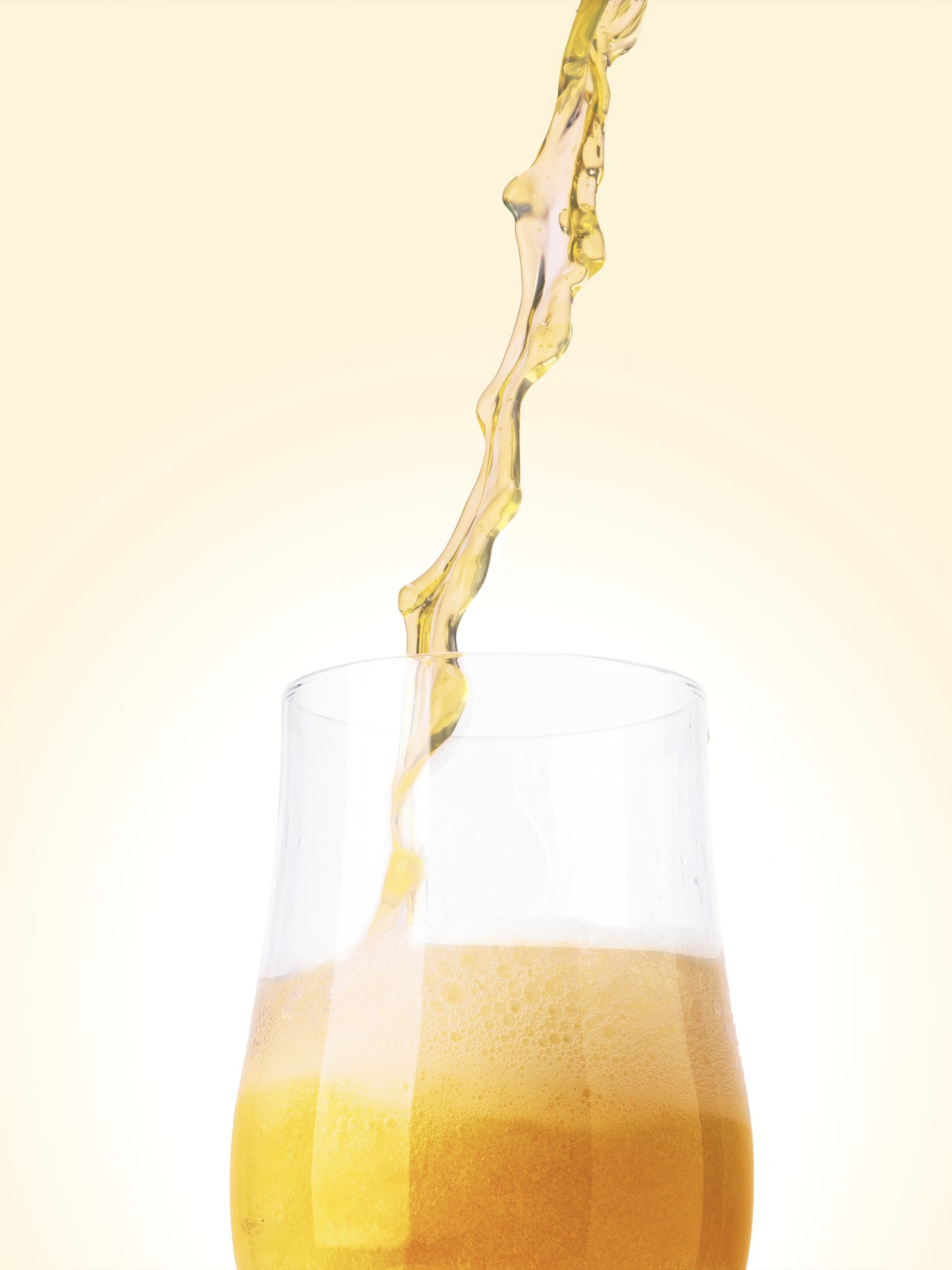 Dynamic pour of Culver Beer Co. craft beer splashing into a stemless glass on a warm cream backdrop. Craft beer photography by Jason Guffy.