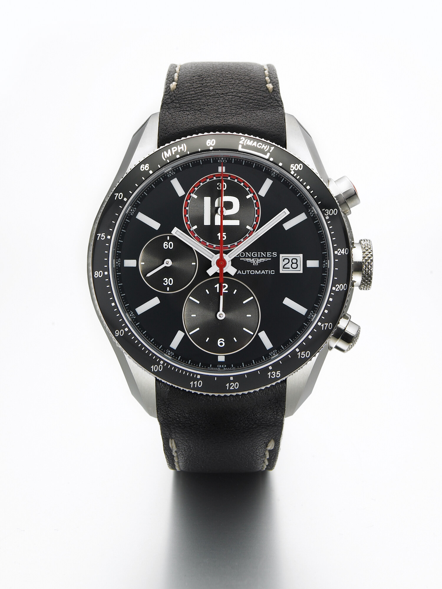 Longines watch with black dial and black leather strap, luxury timepiece product photography. Studio product photography by Jason Guffy.