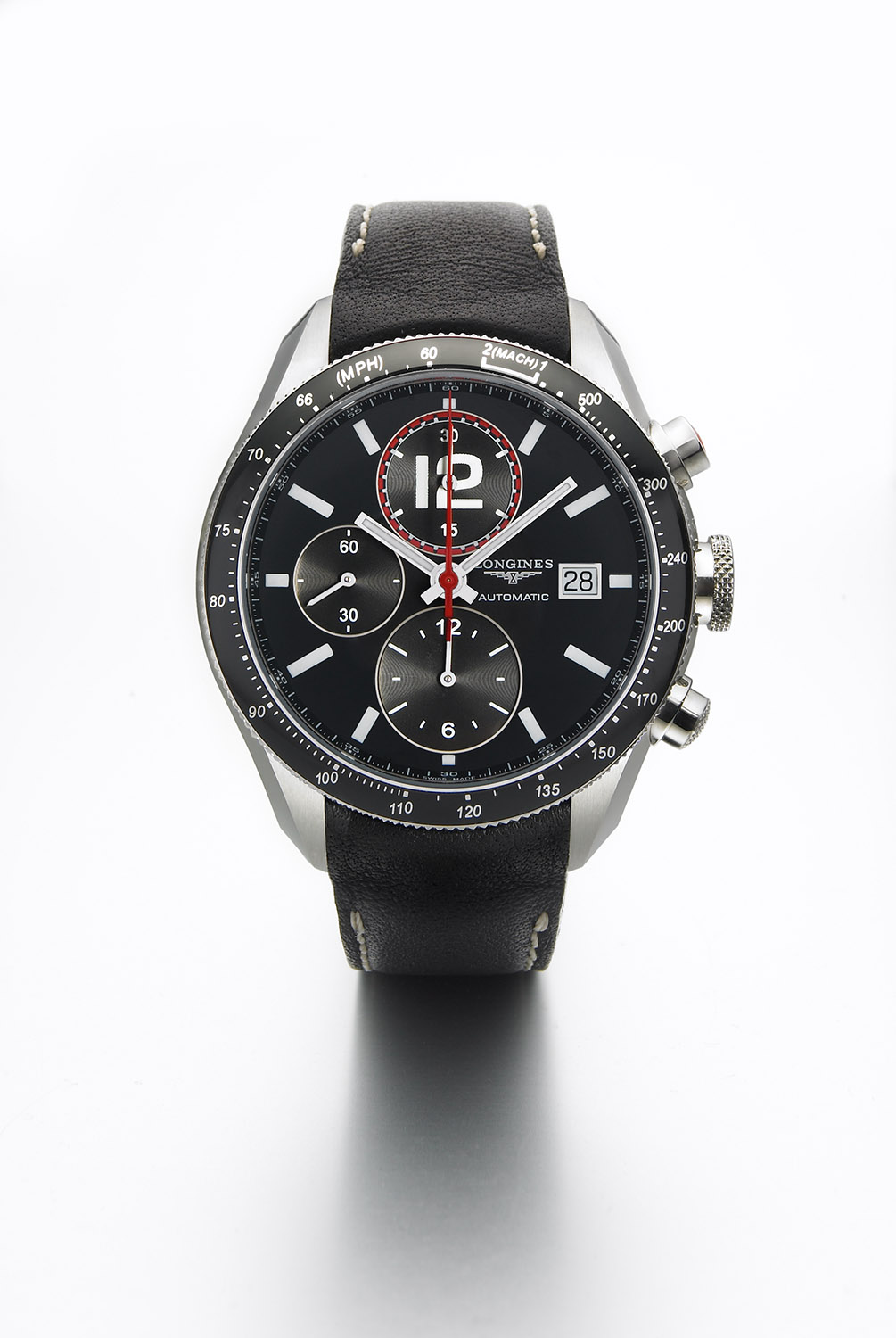 Longines watch with black dial and black leather strap, luxury timepiece product photography. Studio product photograph for commercial campaigns.