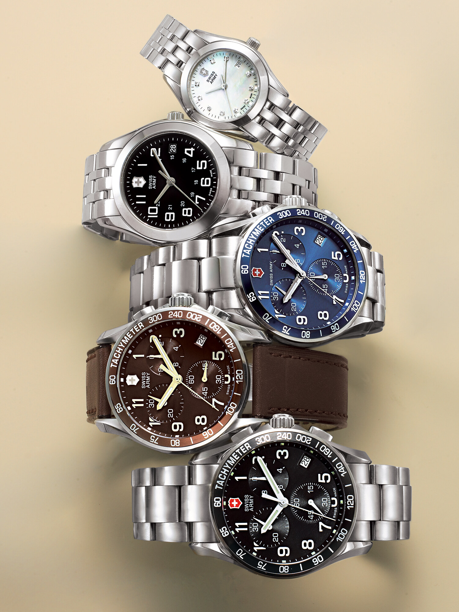 Swiss Army watch with silver case and leather strap, black and blue dial options, precision watch photography. Product photography by Jason Guffy, San Diego.