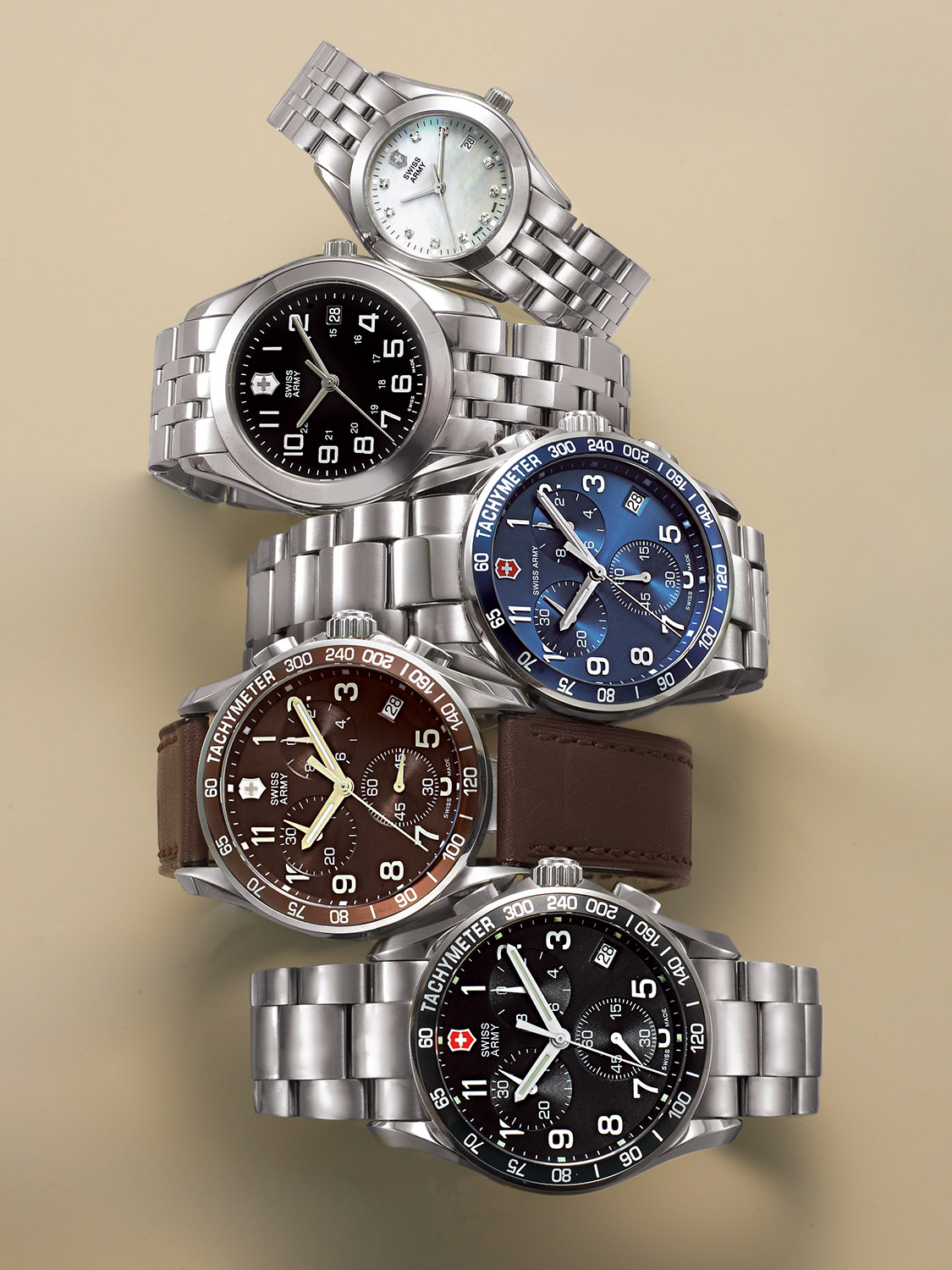 Swiss Army watch with silver case and leather strap, black and blue dial options, precision watch photography. Commercial product photography, San Diego.